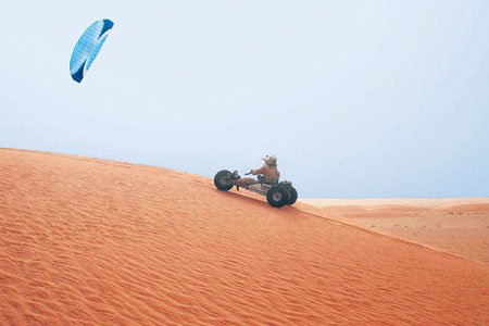 Kite Buggy climbing Sahara sand dune